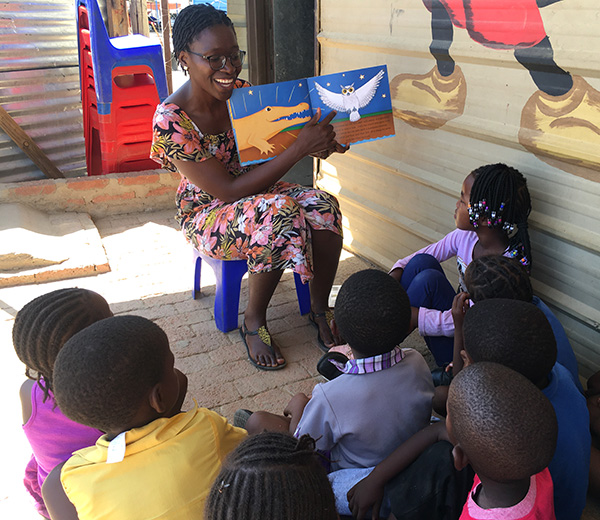 Hilma Weber reading to children in one of the kindergartens in the informal settlements of Windhoek, Namibia.